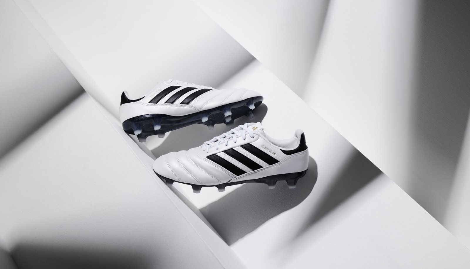 adidas Drop The Copa Icon In "White/Core Black/Gold Met" - featured image