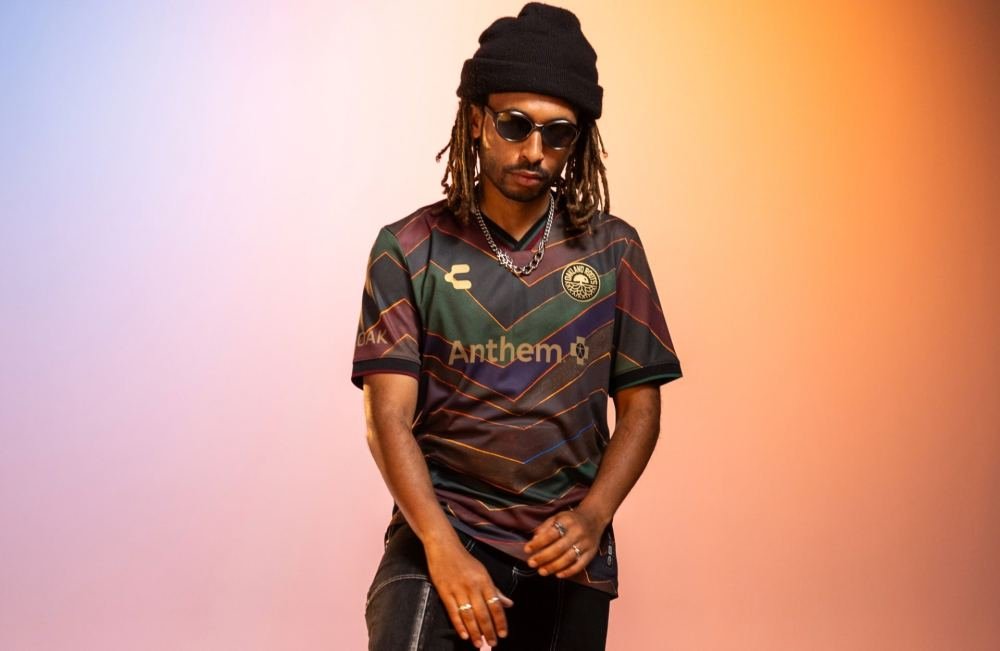 Oakland Roots x CHARLY x Muzae Sesay Third Shirt Lands - featured image
