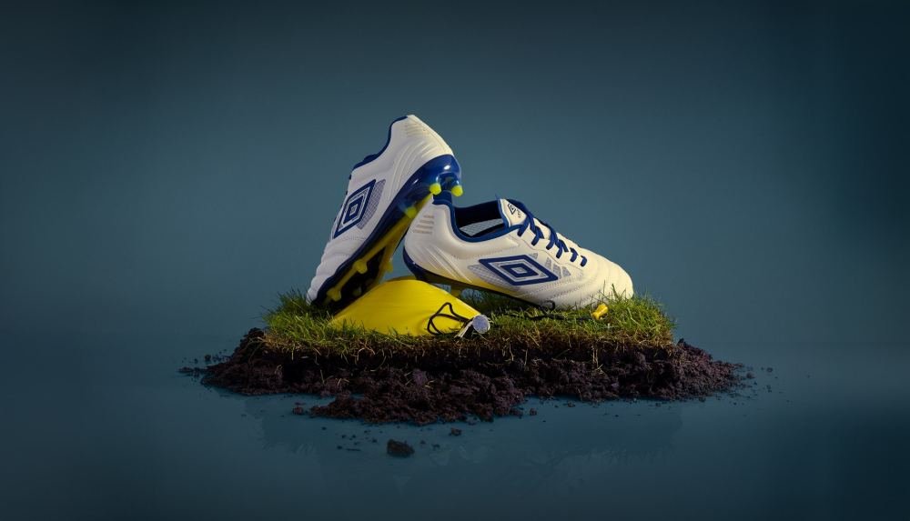 Umbro Update The Tocco Pro IV With "White/Poseidon/Blazing Yellow" Colourway - featured image